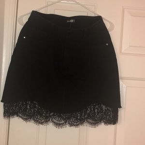 Black denim skirt with lace at the bottom